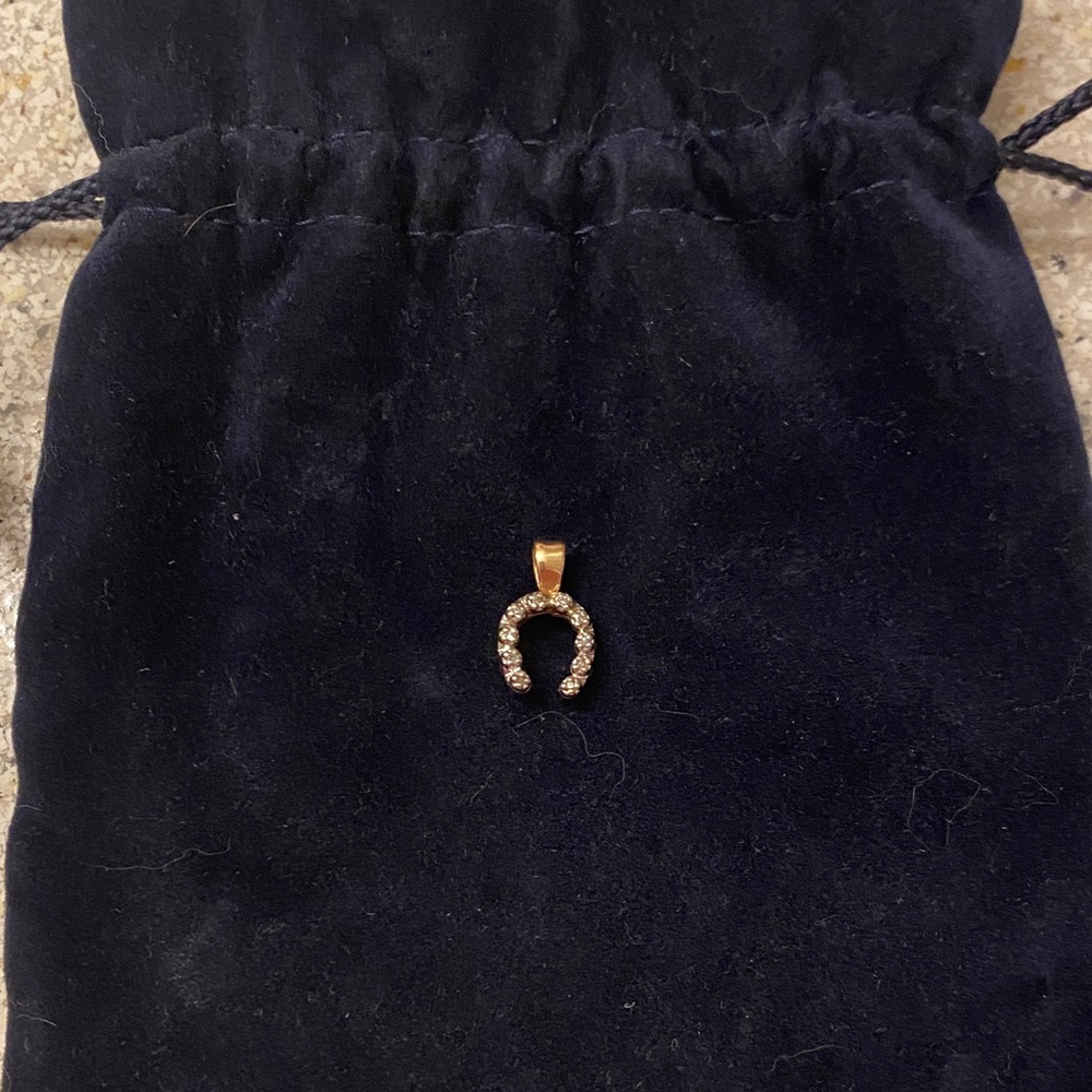 Vintage 1/3 Ct diamond horseshoe pendant in 14K gold. Custom piece.